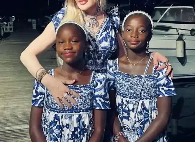 How many biological and adopted children does Madonna have?